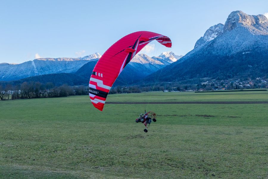 ITV Bulldog 2 trike wing above a grass strip