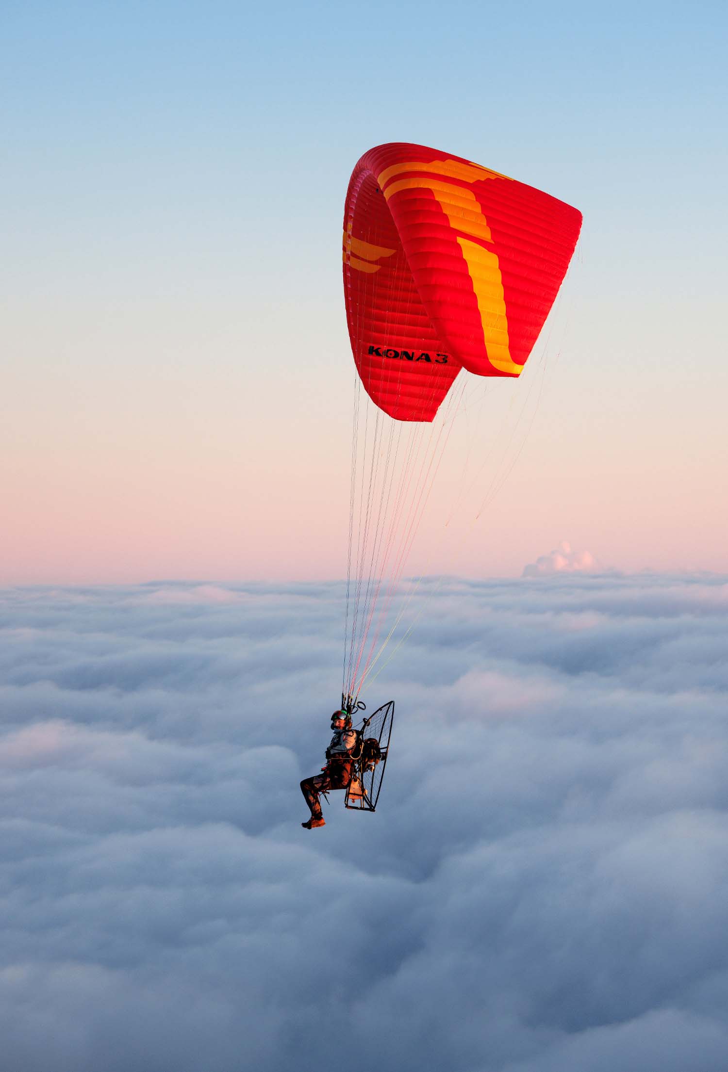 Ozone Kona 3 wing in cruise flight over open country